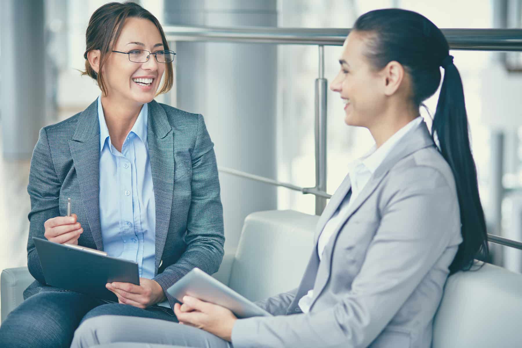Two business women talking
